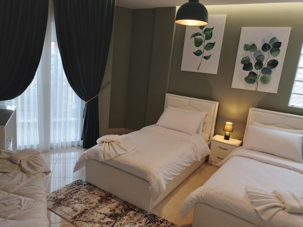 Ajilin Hotel Rooms Корча Экстерьер фото