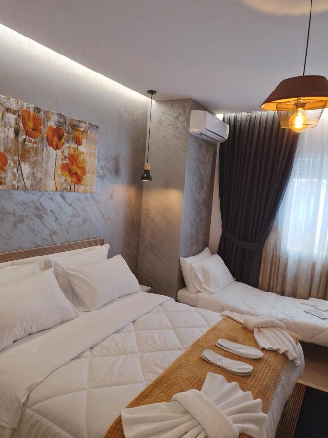 Ajilin Hotel Rooms Корча Экстерьер фото